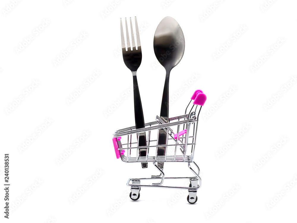 Fork and spoon in the shopping cart isolated on white background. Fork and spoon in the shopping cart isolated on white background.