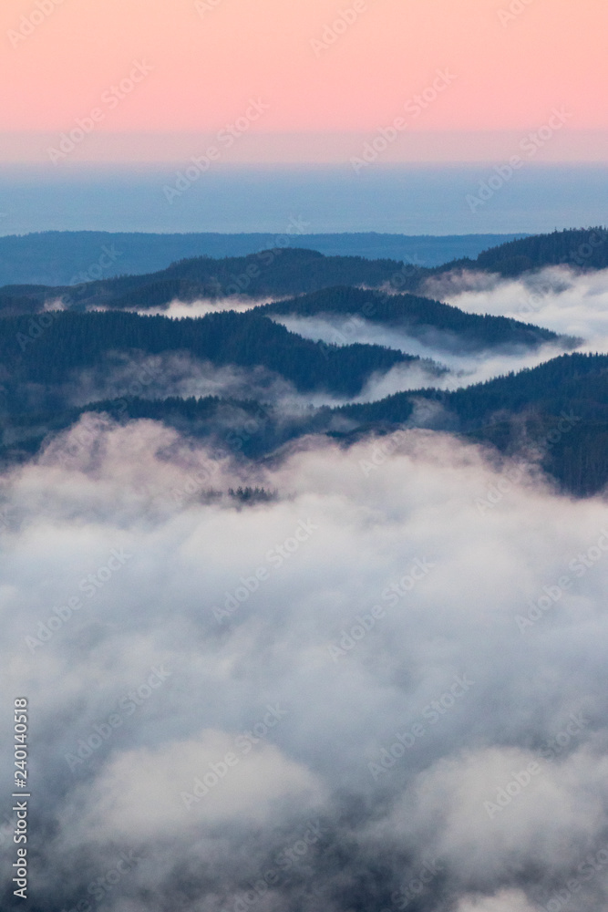 clouds and layers of mountains in the pacific northwest, washington state