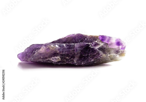 Beautiful natural raw amethyst crystal on white background isolated