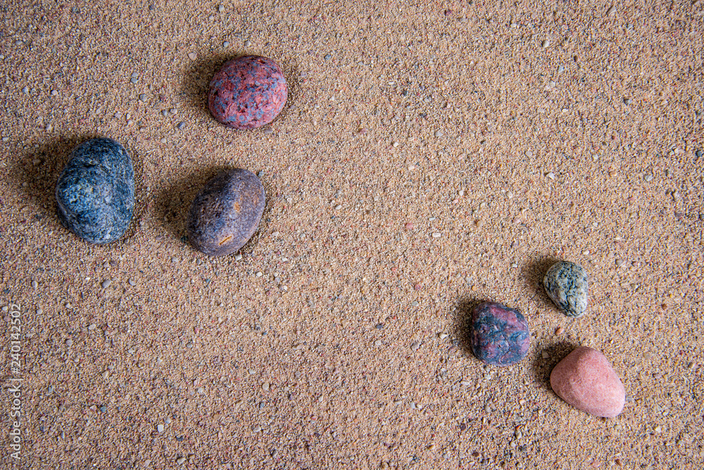 relaxing stones laying on sand textured pattern relaxing stones laying on sand textured pattern