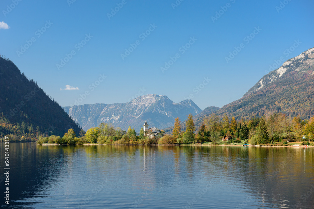 Grundlsee Castle on the sunny autumn day, located on the shore of lake Grundlsee. Grundlsee, Styria, Austria.