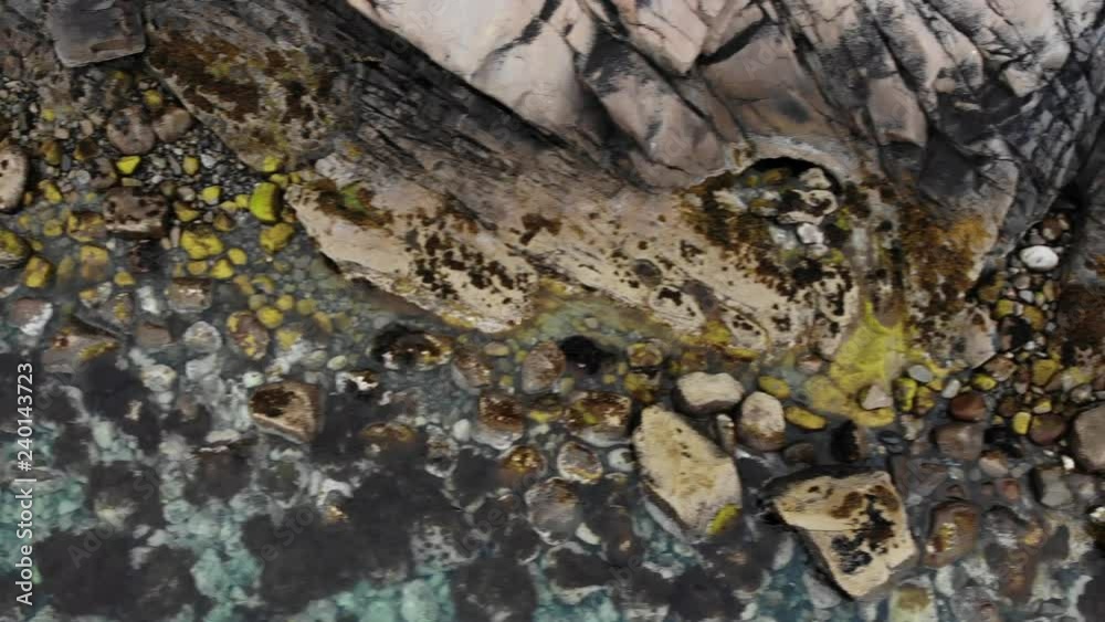 Aerial view. Clear blue sea water with stone rocky fjord shore. Norwegian nature Aerial view. Clear blue sea water with stone rocky fjord shore. Norwegian nature