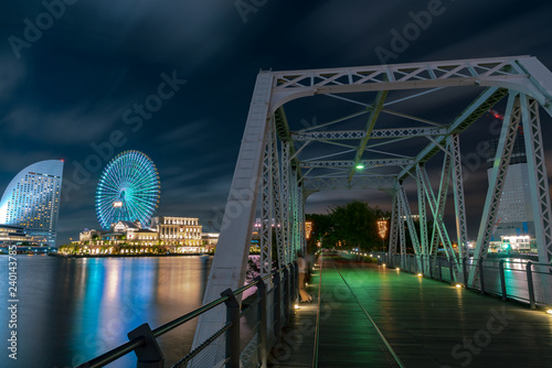 Urban skyline of Minato Mirai 21 area of Yokohama City at night in Kanagawa, Japan. Yokohama is the second largest city in Japan by population and most populous municipality. photo