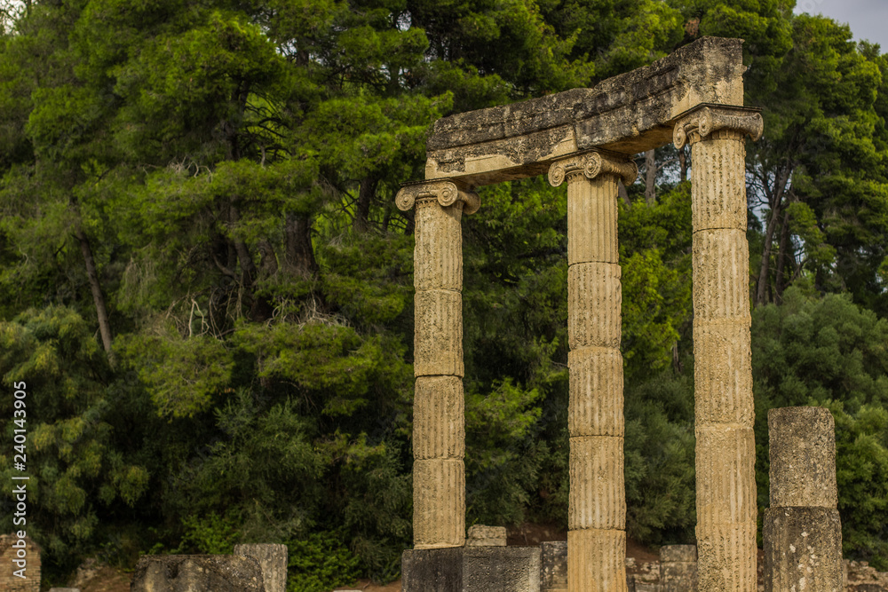 antique marble colonnade architecture concept from ancient Greek times in south European district Peloponnese are in Greece in park outdoor natural touristic and sightseeing space