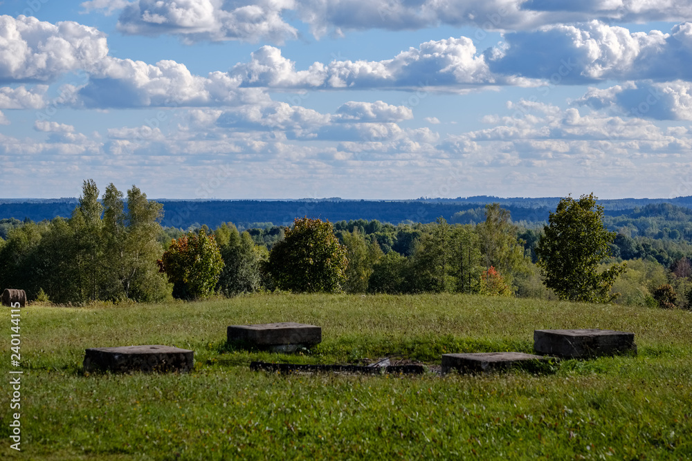 empty countryside landscape in autumn with fields and meadows and rare trees in background empty countryside landscape in autumn with fields and meadows and rare trees in background