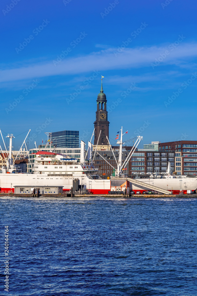 View of Hamburg harbor and downtown Hamburg, Germany, on a sunny afternoon.