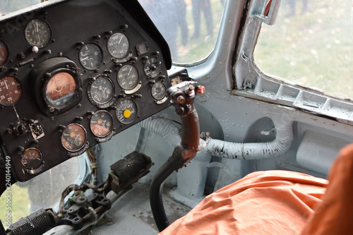 Cabin of a vintage soviet military helicopter, dasboard panel and steering stick, closeup photo