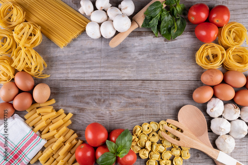 pasta, vegetables, eggs, on wooden board, ingredients for Italian restaurant