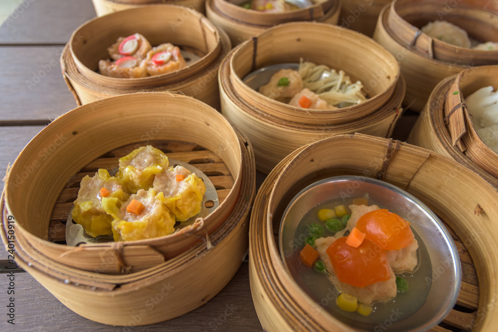 dim sum in bamboo steamer, chinese cuisine. dim sum in bamboo steamer, chinese cuisine.