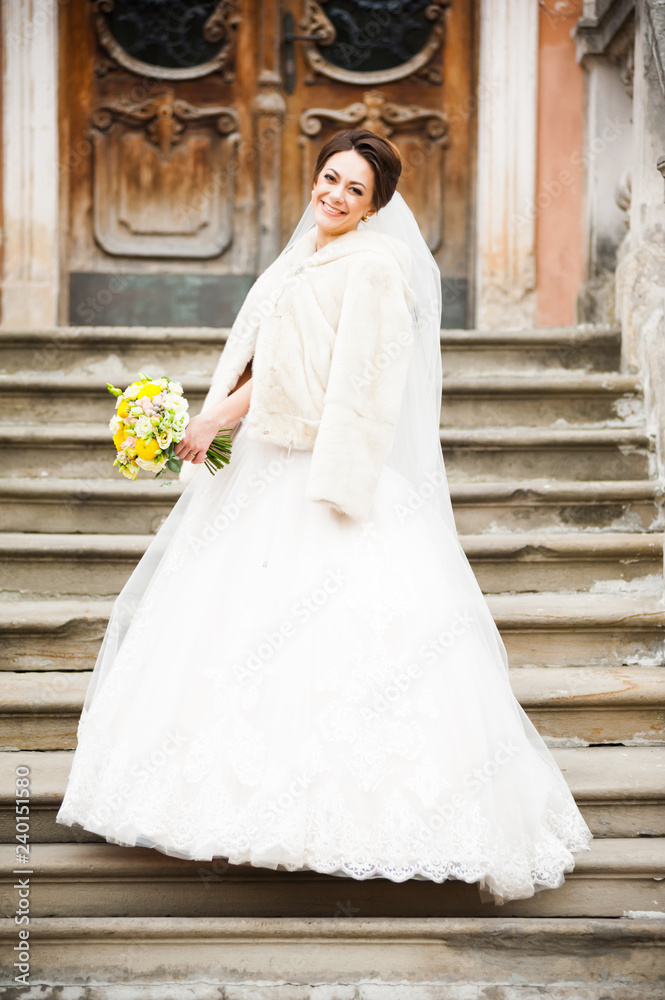 Beautiful european bride walking near old castle and have fun Beautiful european bride walking near old castle and have fun