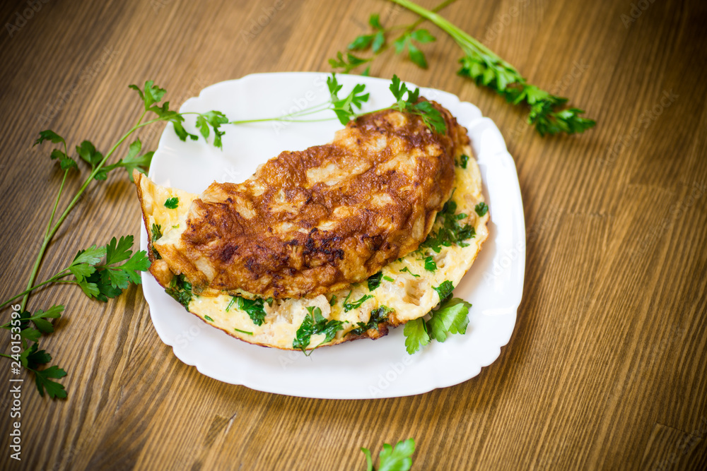 fried omelet with cauliflower and greens in a plate