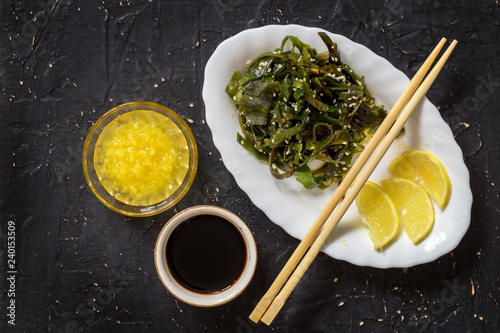 Kelp superfood with sesame, sauce and lemon photo