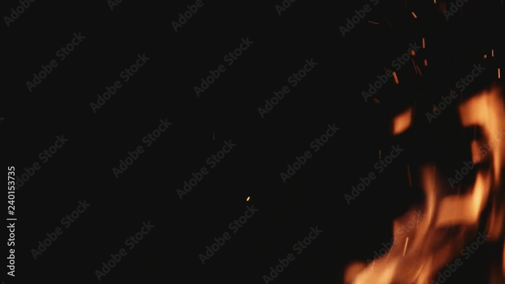 Close up spark flame bright orange home energy wood romantic temperature fireplace explosion hot yellow red glowing light winter slow motion