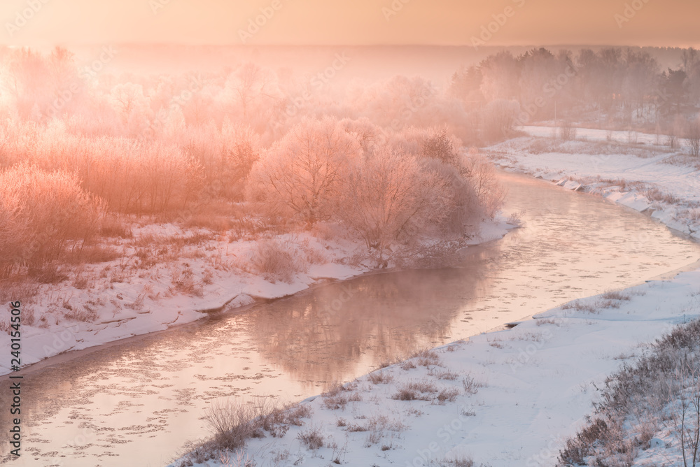 Fototapeta premium winter panorama landscape with forest, trees covered snow and sunrise. winterly morning of a new day. red winter landscape with river snow and forest