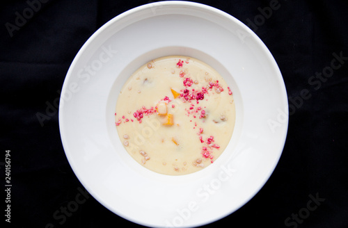 porridge on a white plate with colored dust