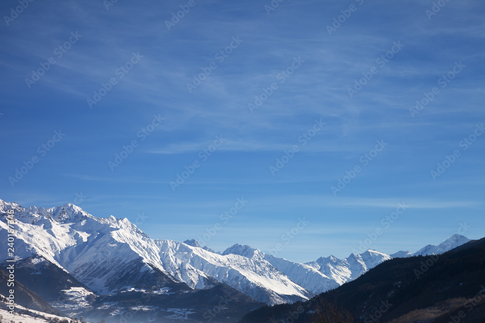 View on snowy mountains and beautiful blue sky in nice sunny morning