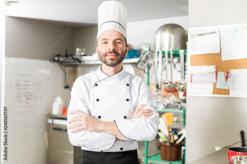 Male Cook Working In Restaurant