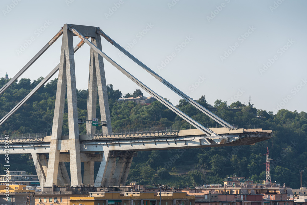 Obraz premium Genoa (Genova), Italy, what is left of collapsed Morandi Bridge (Polcevera viaduct) connecting A10 motorway after structural failure causing 43 casualties on August 14, 2018