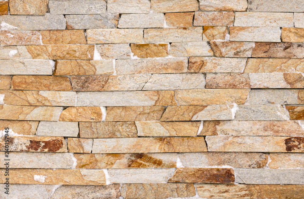 Fototapeta premium Orange facing stone, slate, sandstone and travertine marble texture