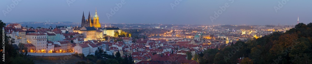 Prague - The panorama of the Town with the Castle and St. Vitus cathedral at dusk.