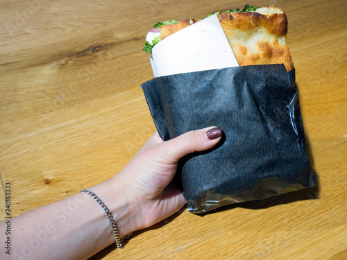 Sandwich in a woman's hand