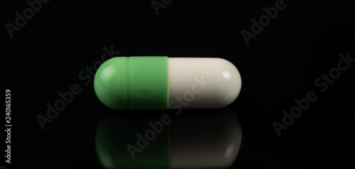 pills on black  background