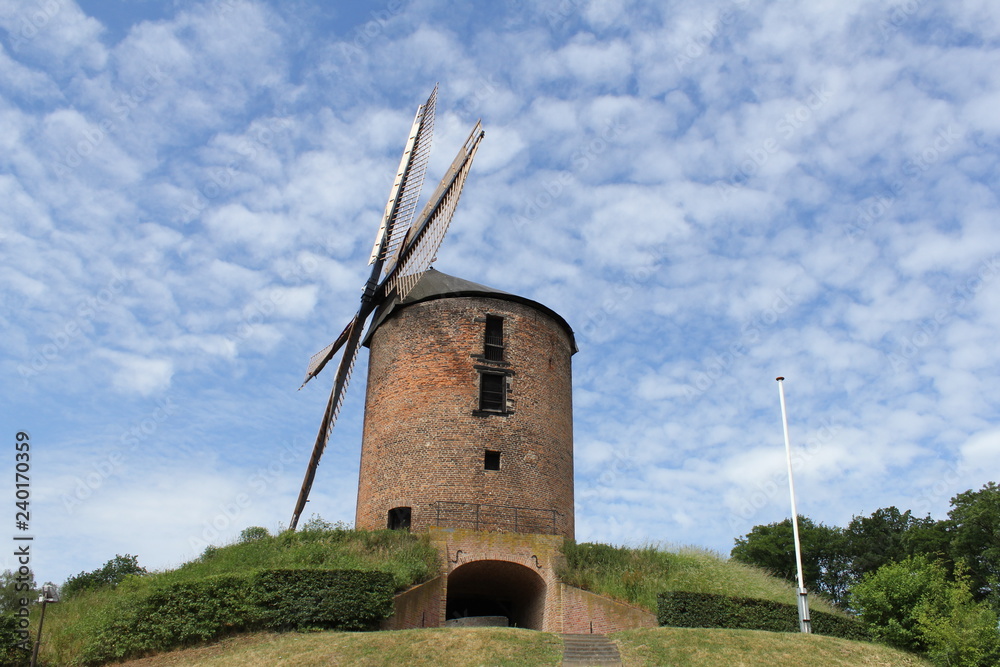 the corn mill of zeddam, holland with a blue sky in summer the corn mill of zeddam, holland with a blue sky in summer