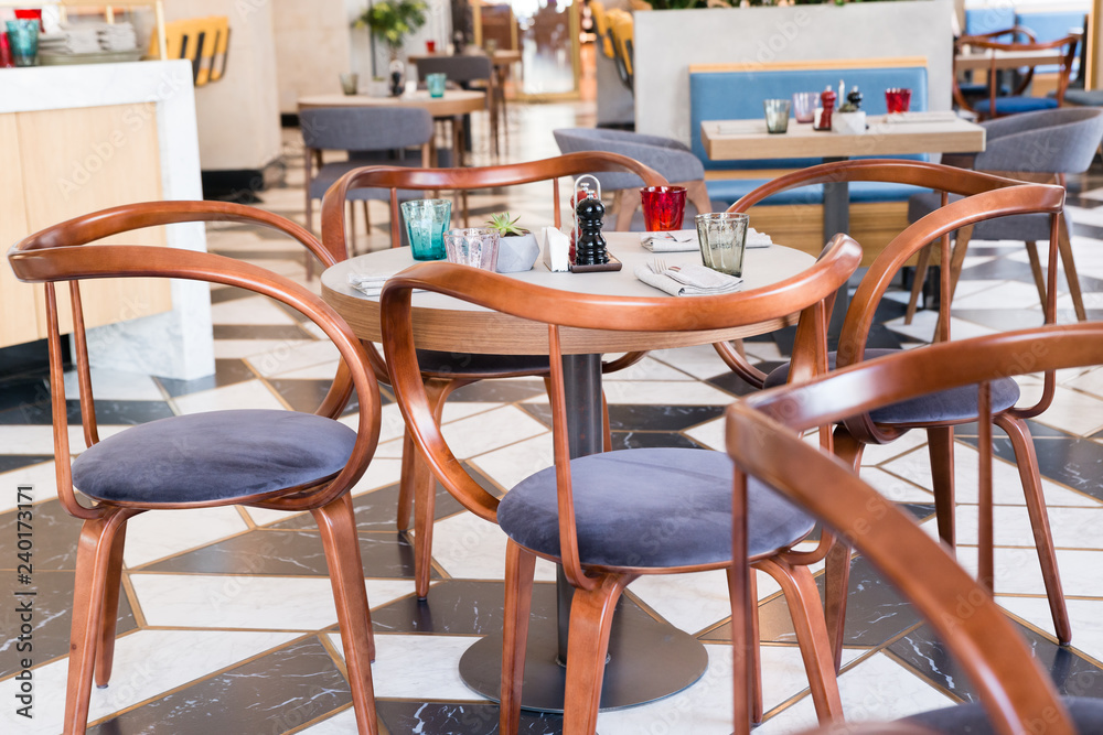 Designer chairs made of bent plywood in the interior of the cafe
