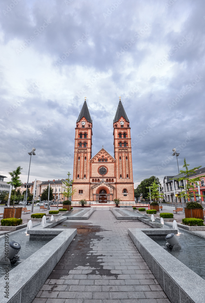 The twin-towered Nyiregyháza's Roman Catholic church with the newly built fountain in the foreground