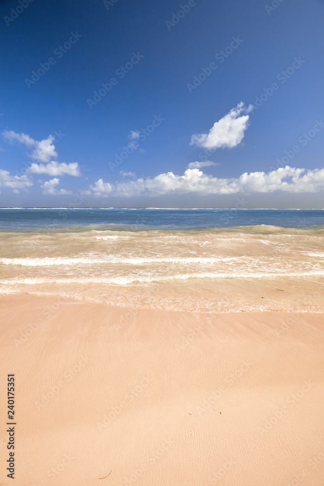 Soft Wave Of Blue Ocean On Sandy Beach. Background. Splash of waves on the sandy beach. foam, surf, waves Soft Wave Of Blue Ocean On Sandy Beach. Background. Splash of waves on the sandy beach. foam, surf, waves