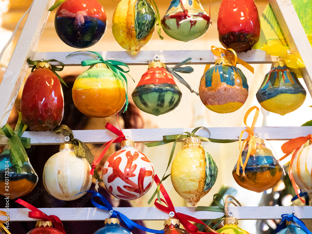 Features hand painted ceramic Christmas balls.