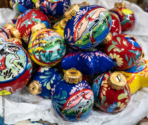 Features hand painted ceramic Christmas balls.