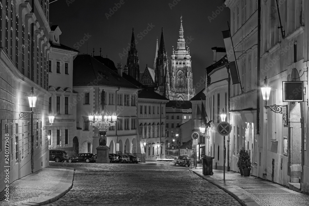 Prague - The St. Vitus cathedral and the Loretánská street at night.