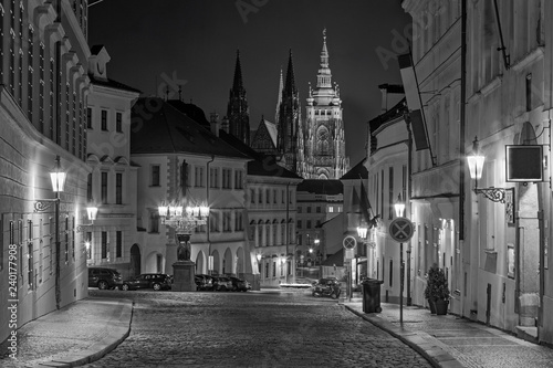 Prague - The St. Vitus cathedral and the Loretánská street at night.