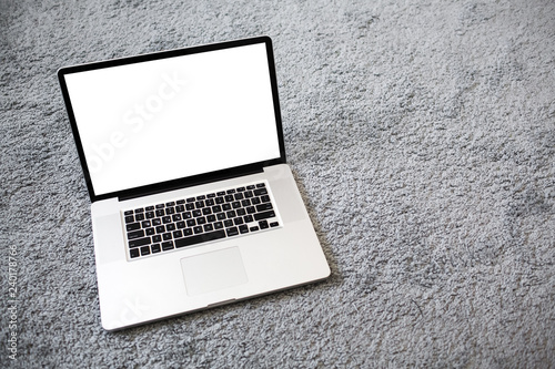 Modern laptop with mockup isolated on textured background.