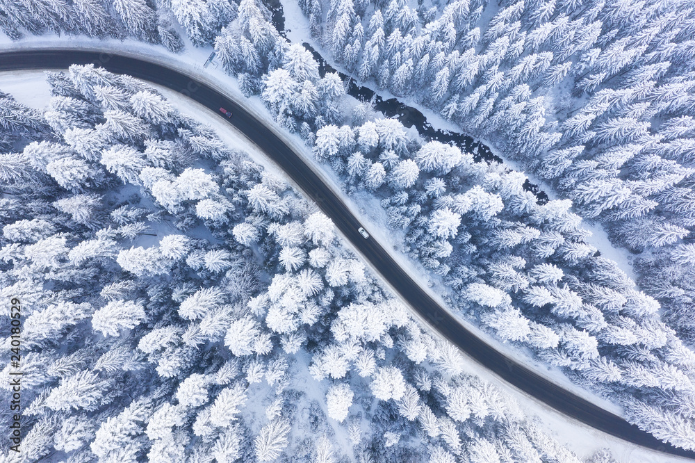 Aerial view on the road and forest at the winter time. Natural winter  landscape from air. Forest under snow a the winter time. Landscape from  drone Stock Photo | Adobe Stock