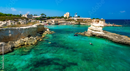 Panorama of the beach in Salento, sunny day and clean blue water on the coast of Lecce, Italy