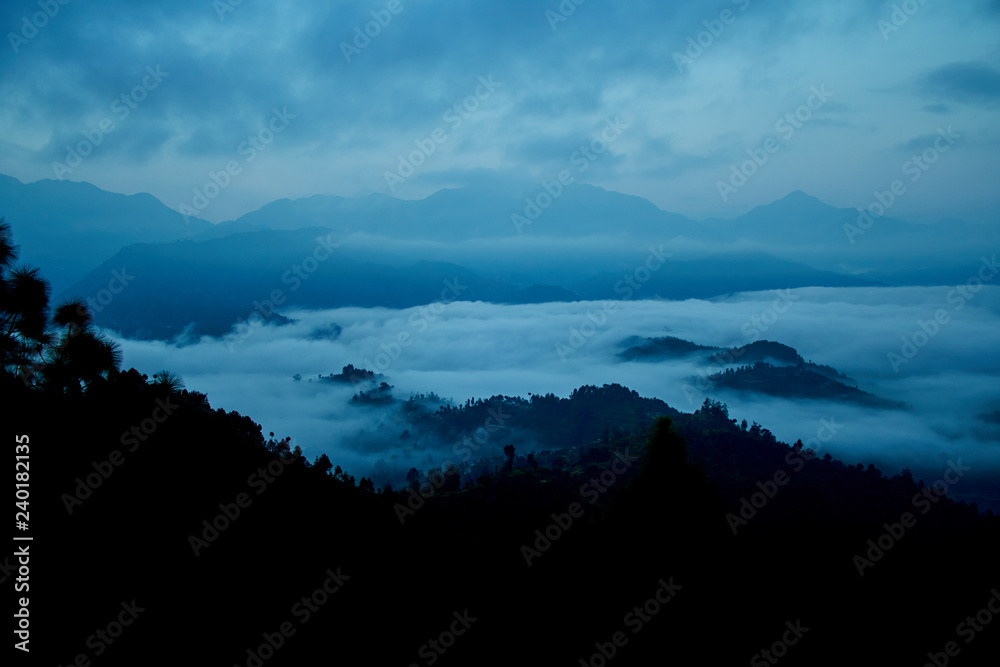 Fog above mountain in valley Himalayas mountains