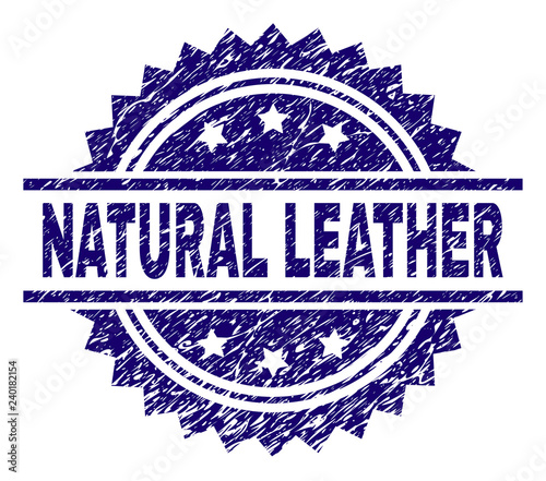 NATURAL LEATHER stamp seal watermark with distress style. Blue vector rubber print of NATURAL LEATHER label with retro texture.