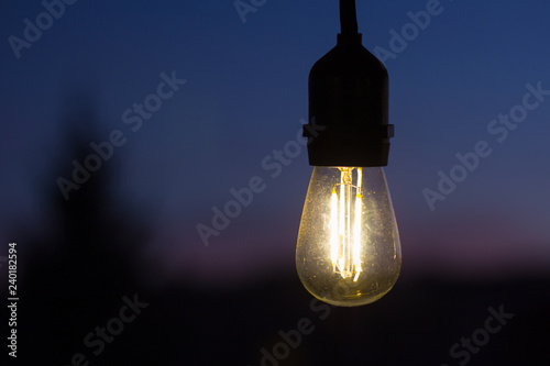 single String Light in Suspended at Sunset from the Porch