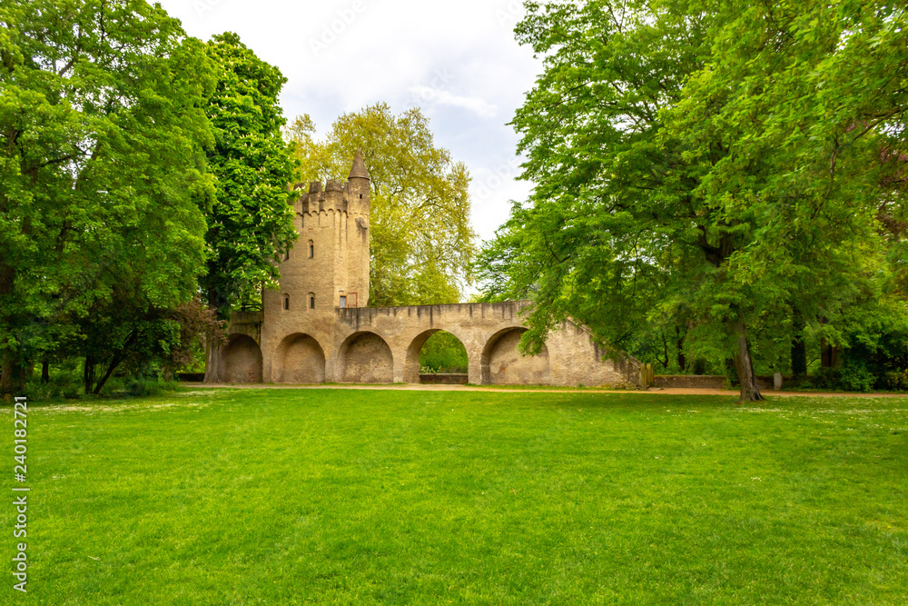 Park behind Speyer Cathedral with old city fortification and tower, Speyer, Germany