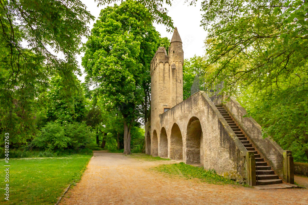 Park behind Speyer Cathedral with old city fortification and tower, Speyer, Germany Park behind Speyer Cathedral with old city fortification and tower, Speyer, Germany