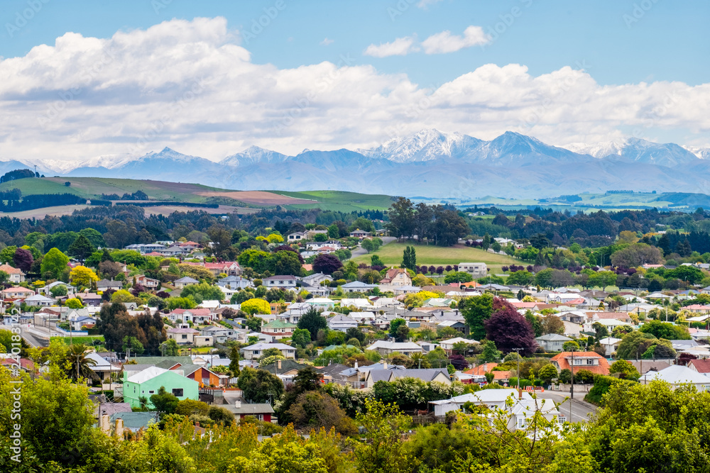 Beautiful landscape of the town with blue sky and snow mountain. Omaru, New Zealand.