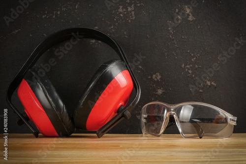 Safety Personal Protective Equipment(PPE) on a rustic black background. photo