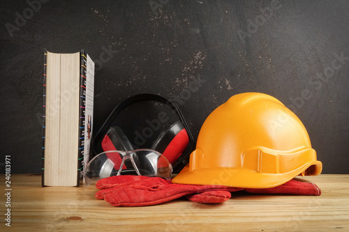 Safety Personal Protective Equipment(PPE) on a rustic black background. photo