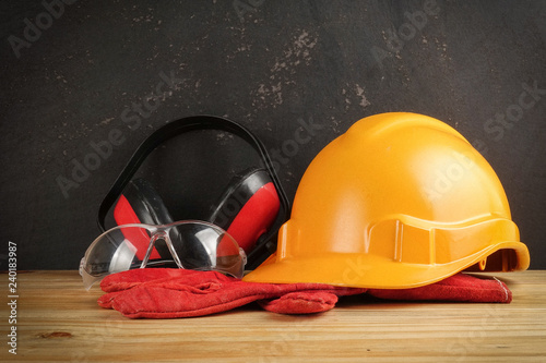 Safety Personal Protective Equipment(PPE) on a rustic black background. photo