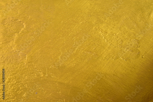 Abstract gold concrete wall texture. Golden on cement wall background for backdrop or design
