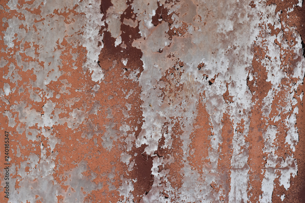 Peeling paint on cement wall texture. Pattern of rustic red grunge. Peeling paint on cement wall texture. Pattern of rustic red grunge.
