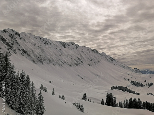 Ski slopes and snow-capped mountains in Hoch-Ybrig, Switzerland.