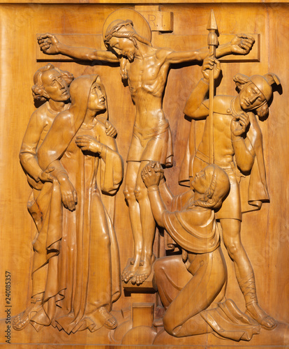 PRAGUE, CZECH REPUBLIC - OCTOBER 15, 2018: The wooden carved relief of Cricifixion in church Bazilika svatého Petra a Pavla na Vyšehrade from 20. cent. photo